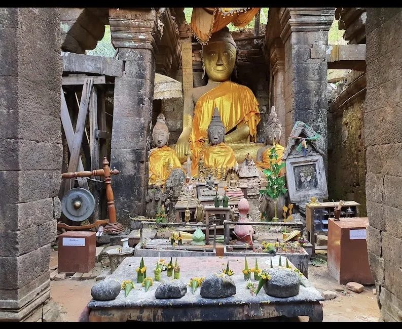 Buddha statues and sacred objects inside Wat Phou temple, Champasak, Laos